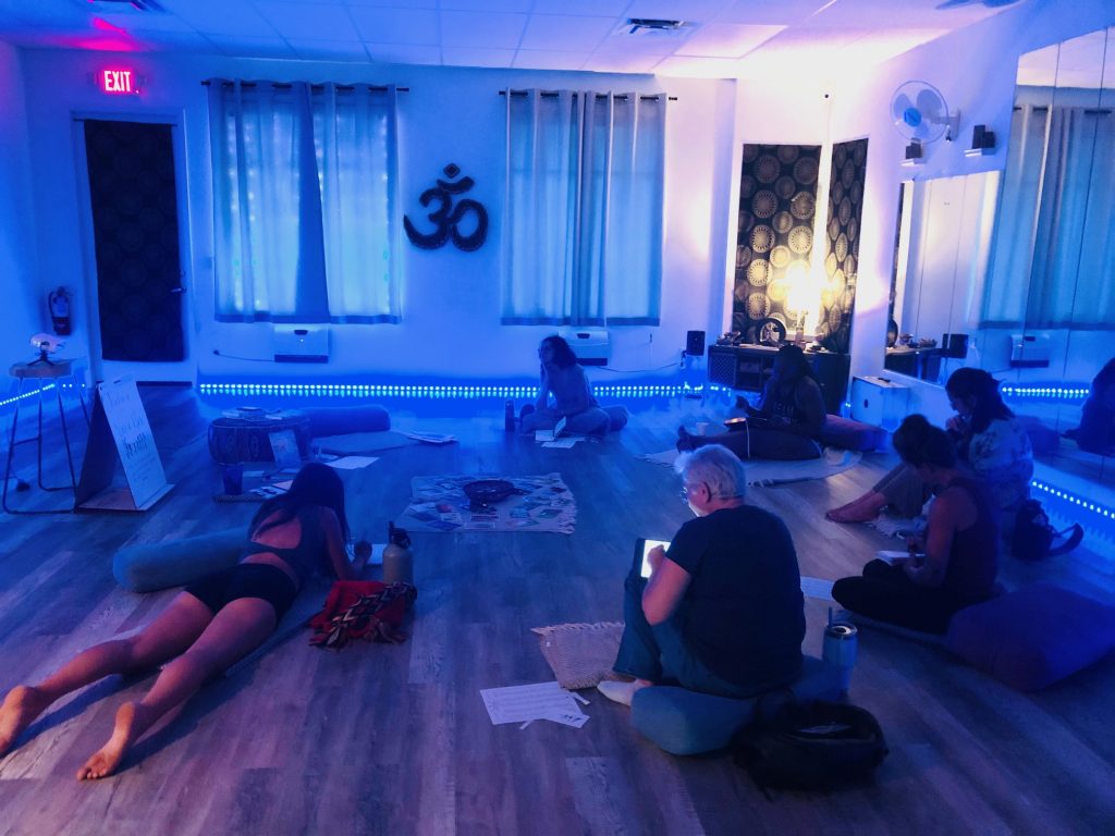 Women journaling during a Word Flow creative writing workshop